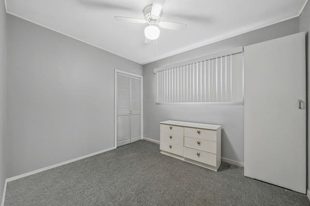 unfurnished bedroom featuring carpet flooring, ceiling fan, and a closet