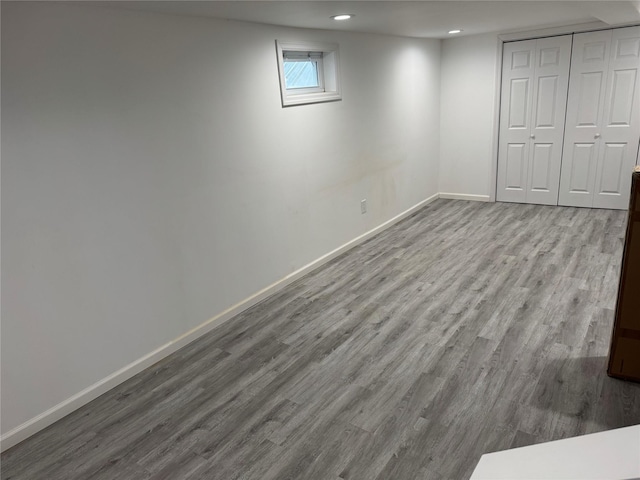 basement featuring light hardwood / wood-style flooring