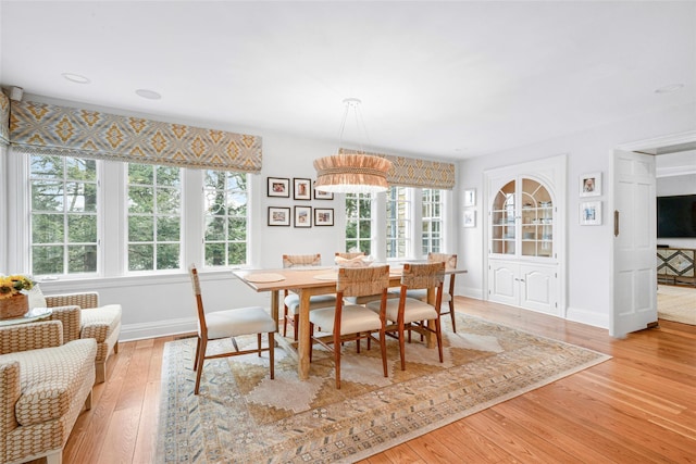 dining space with light wood-type flooring