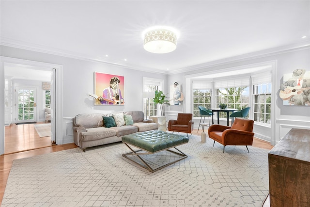 living room featuring crown molding and wood-type flooring