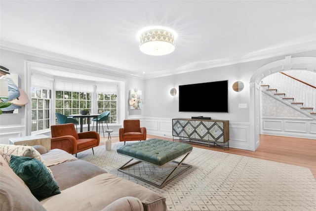 living room featuring crown molding and wood-type flooring