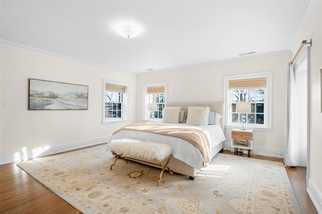 bedroom featuring crown molding and hardwood / wood-style flooring