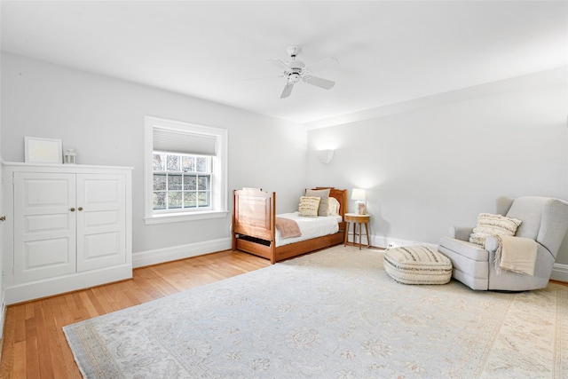 bedroom with hardwood / wood-style flooring and ceiling fan