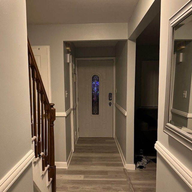 corridor with wood-type flooring