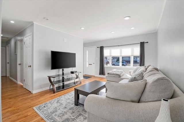 living room featuring crown molding and hardwood / wood-style floors