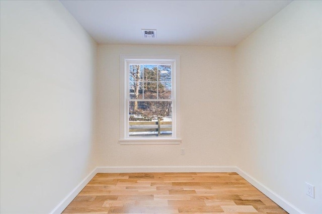 spare room featuring light hardwood / wood-style flooring