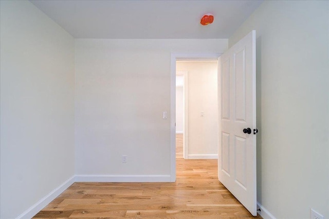 spare room featuring light wood-type flooring