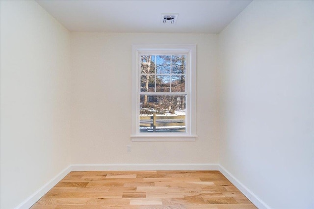 unfurnished room featuring light wood-type flooring