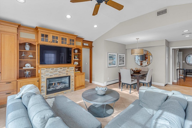 tiled living room featuring a baseboard radiator, a stone fireplace, lofted ceiling, and ceiling fan