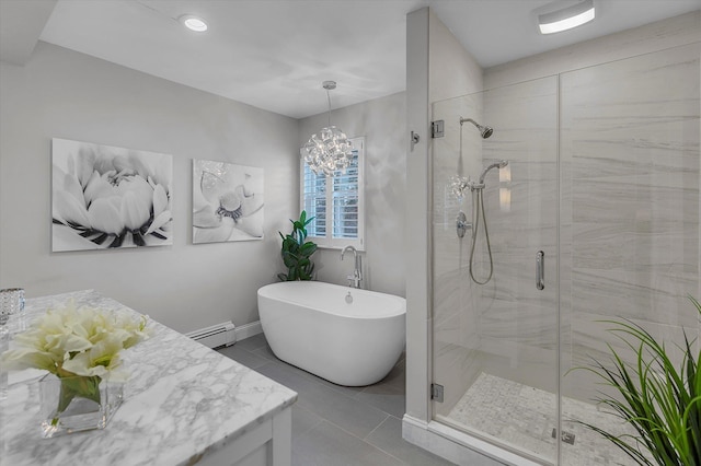 bathroom featuring independent shower and bath, a baseboard heating unit, and tile patterned floors