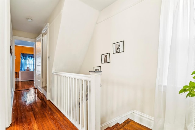 hallway with dark wood-type flooring