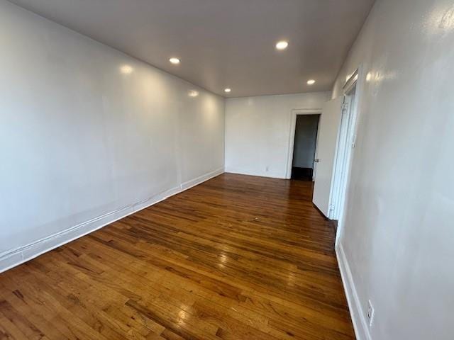 unfurnished room featuring dark hardwood / wood-style floors