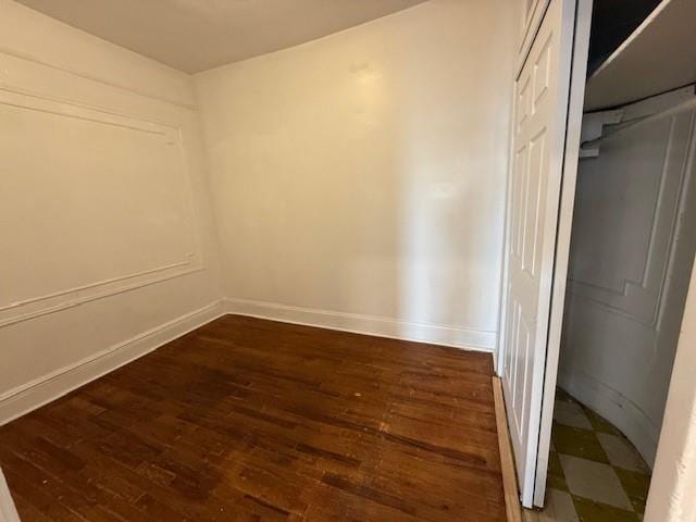 unfurnished room featuring dark hardwood / wood-style floors