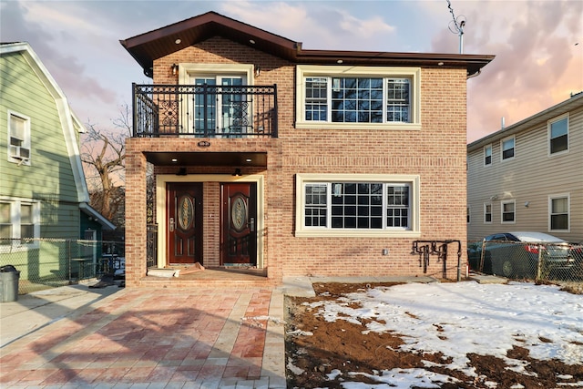 view of front of home with a balcony