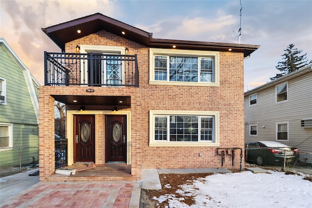 view of front of property with a balcony