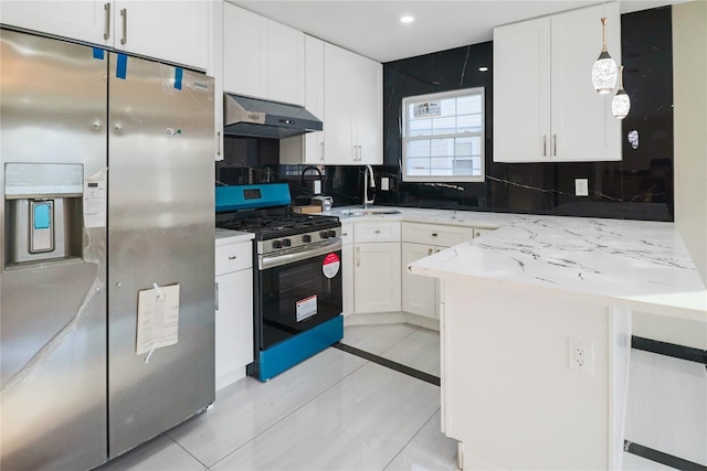 kitchen with stainless steel appliances, light tile patterned floors, and white cabinets