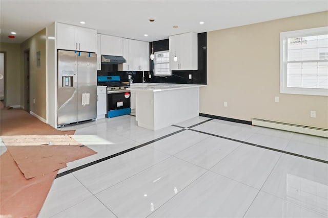 kitchen featuring white cabinets, decorative backsplash, a baseboard heating unit, light tile patterned floors, and stainless steel appliances