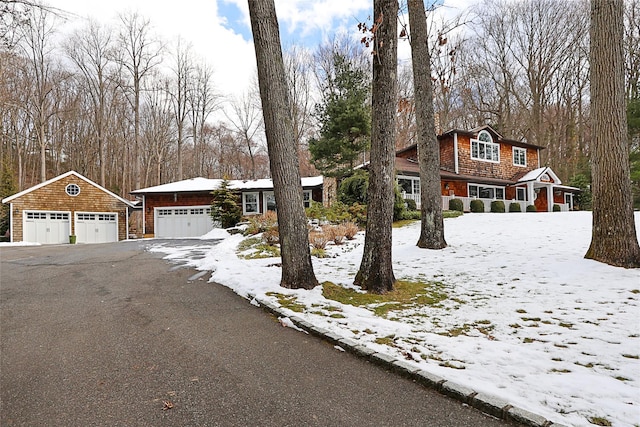 view of front facade featuring an outbuilding and a garage