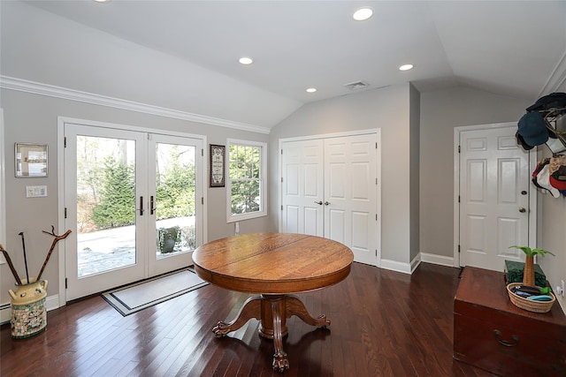 dining area with vaulted ceiling, dark hardwood / wood-style floors, and french doors