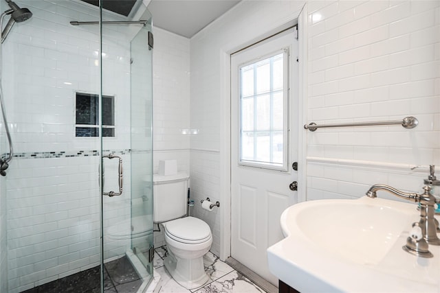 bathroom featuring walk in shower, sink, tile walls, and toilet