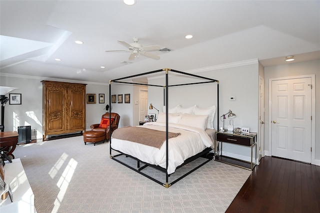 bedroom featuring crown molding, ceiling fan, and light hardwood / wood-style flooring