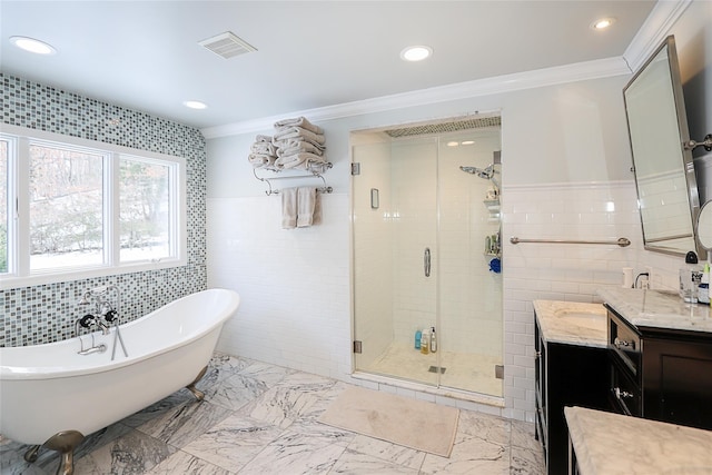 bathroom featuring ornamental molding, vanity, separate shower and tub, and tile walls