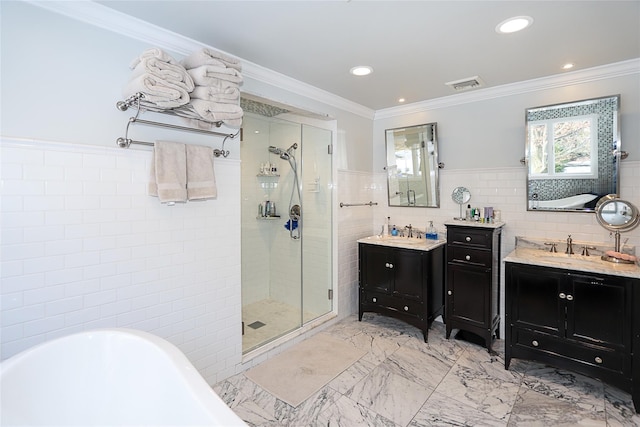 bathroom featuring tile walls, vanity, ornamental molding, and shower with separate bathtub