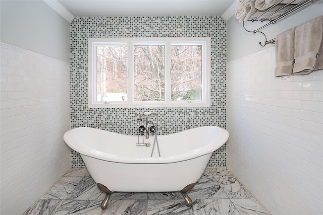 bathroom with a bathtub and tile walls