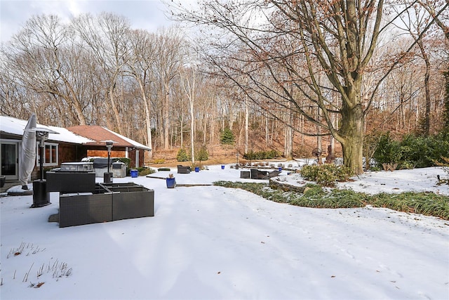 view of yard layered in snow