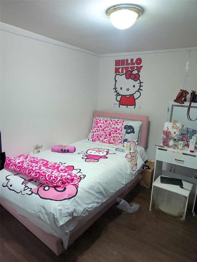 bedroom featuring wood finished floors