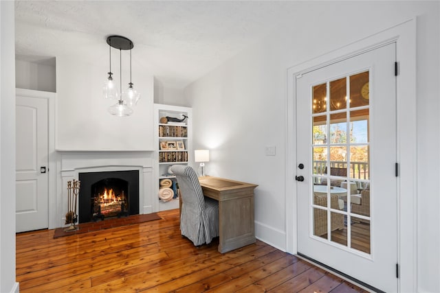 office area featuring hardwood / wood-style floors and a textured ceiling