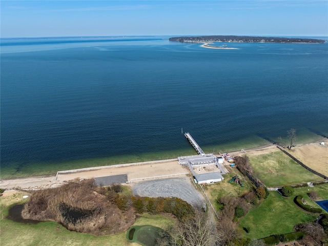 birds eye view of property with a beach view and a water view