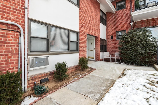 view of snow covered property entrance