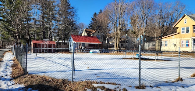 view of basketball court featuring fence