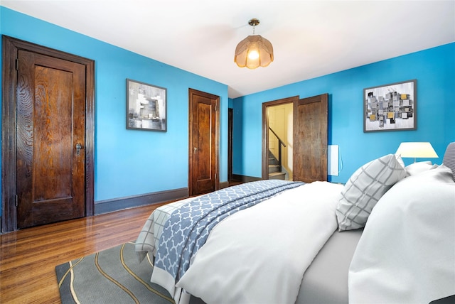 bedroom featuring hardwood / wood-style flooring and a closet