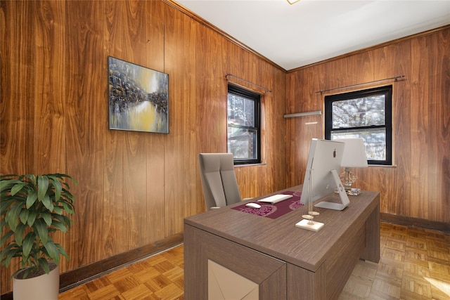 home office with light parquet flooring and wooden walls