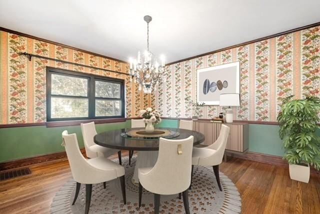 dining room featuring hardwood / wood-style floors and a notable chandelier