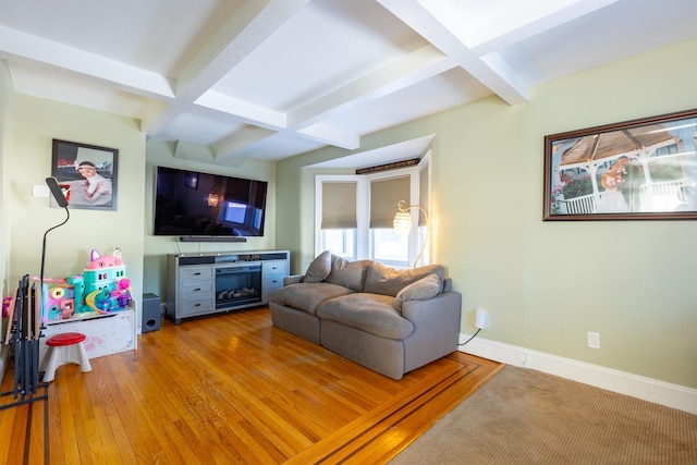 living room with coffered ceiling, hardwood / wood-style flooring, and beamed ceiling