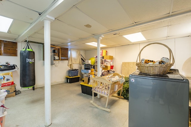 basement featuring washer / clothes dryer and fridge