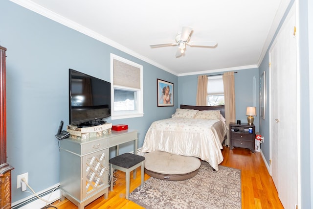 bedroom featuring multiple windows, a baseboard radiator, ceiling fan, and light hardwood / wood-style floors