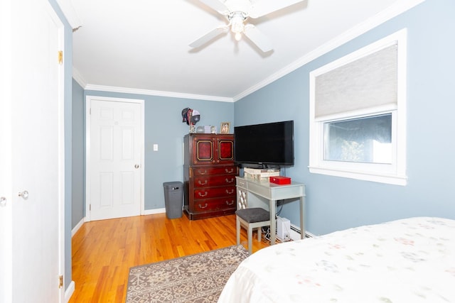 bedroom with a baseboard radiator, wood-type flooring, ornamental molding, and ceiling fan