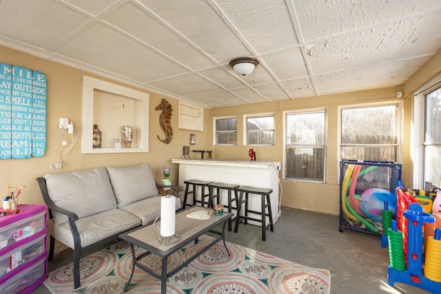 sunroom / solarium featuring a drop ceiling