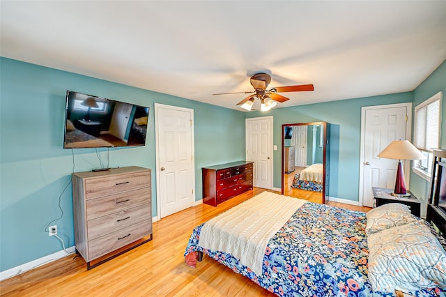 bedroom with ceiling fan and light hardwood / wood-style flooring