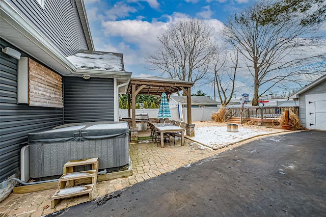 view of patio / terrace featuring a gazebo and a hot tub