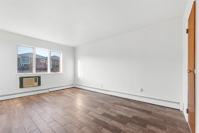 spare room with wood-type flooring and an AC wall unit