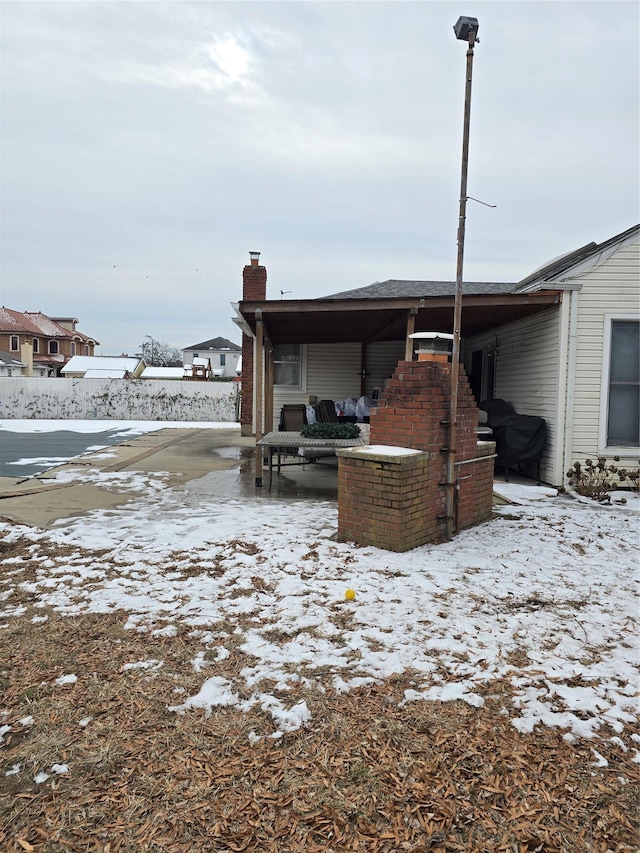 view of snow covered property