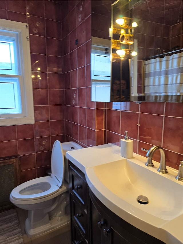 bathroom with tasteful backsplash, tile walls, vanity, toilet, and a shower with shower curtain