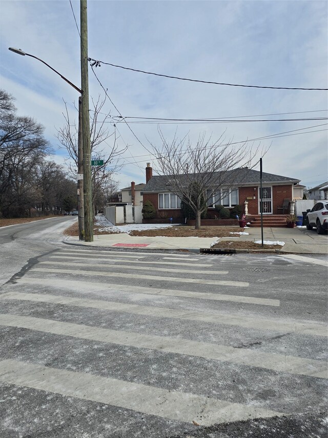 15731 80th St, Howard Beach, NY 11414 - view of front of home with a chimney