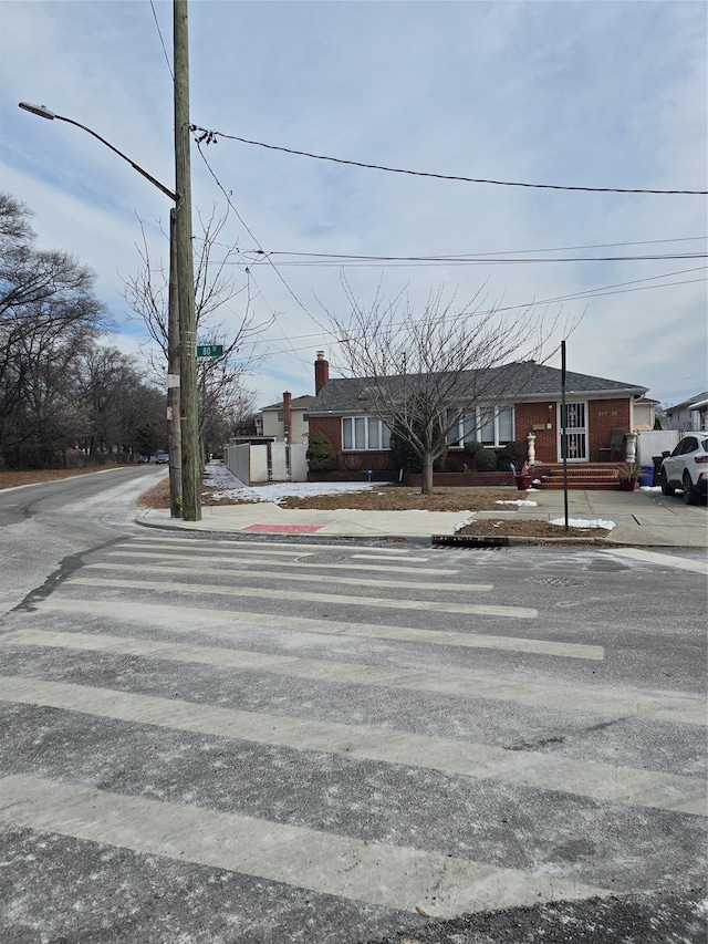 15731 80th St, Howard Beach, NY 11414 - view of front of home with a chimney