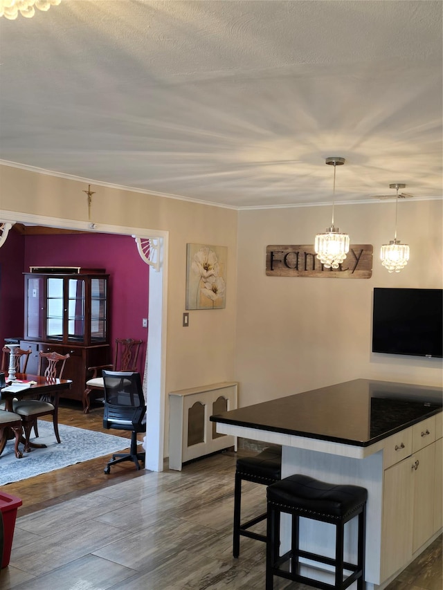 15731 80th St, Howard Beach, NY 11414 - dining area featuring dark wood-style floors, a chandelier, a textured ceiling, and crown molding